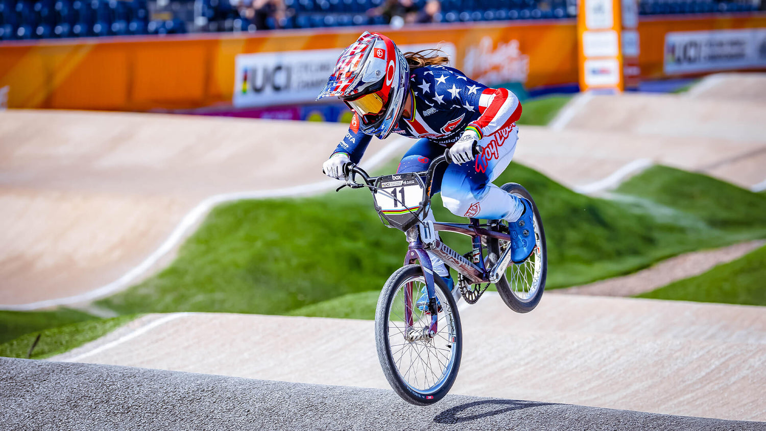 BMX rider going over a jump at the track
