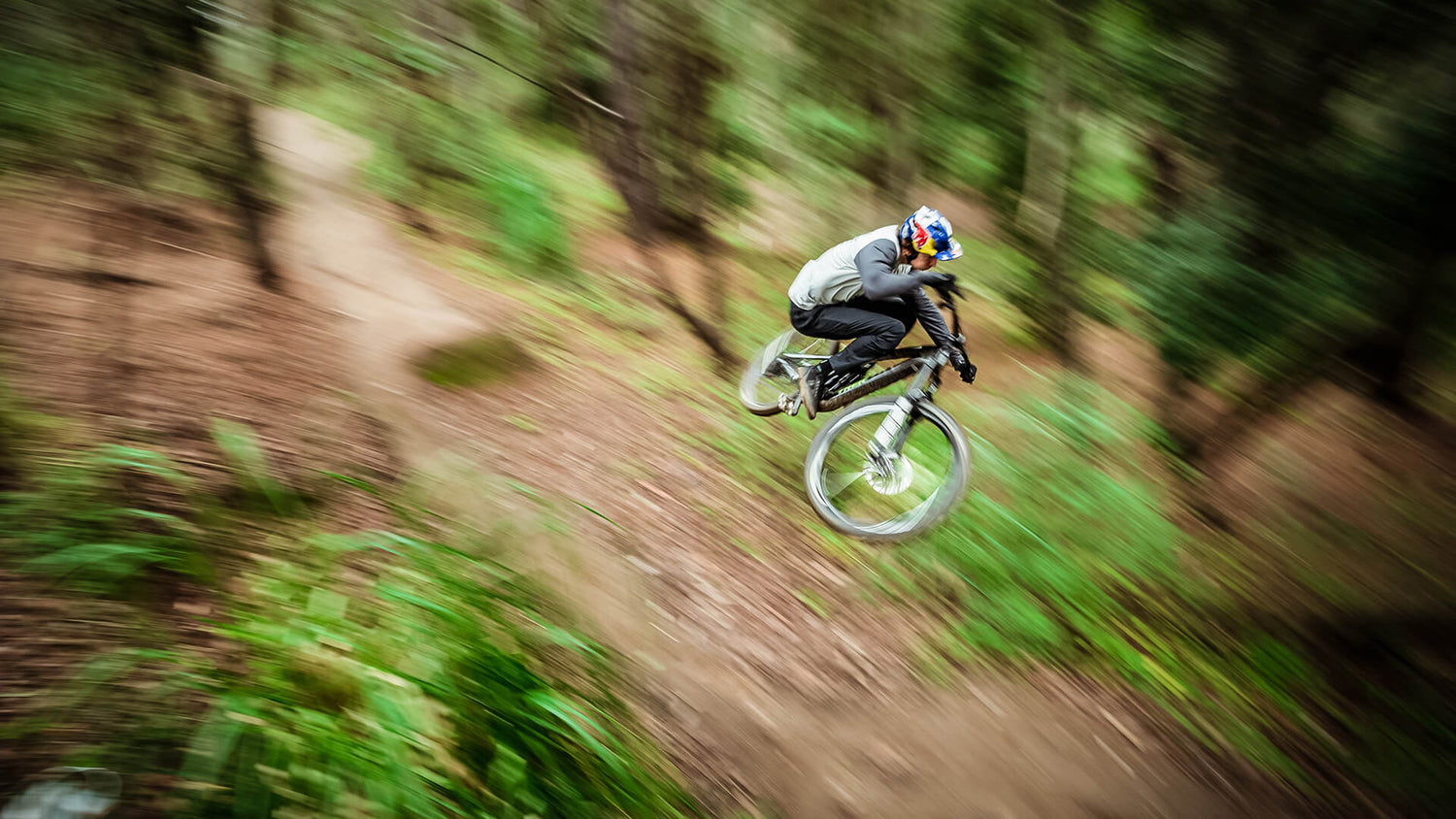 Troy Lee Designs Moutain bike rider, in the Ruckus collection, going down a hill